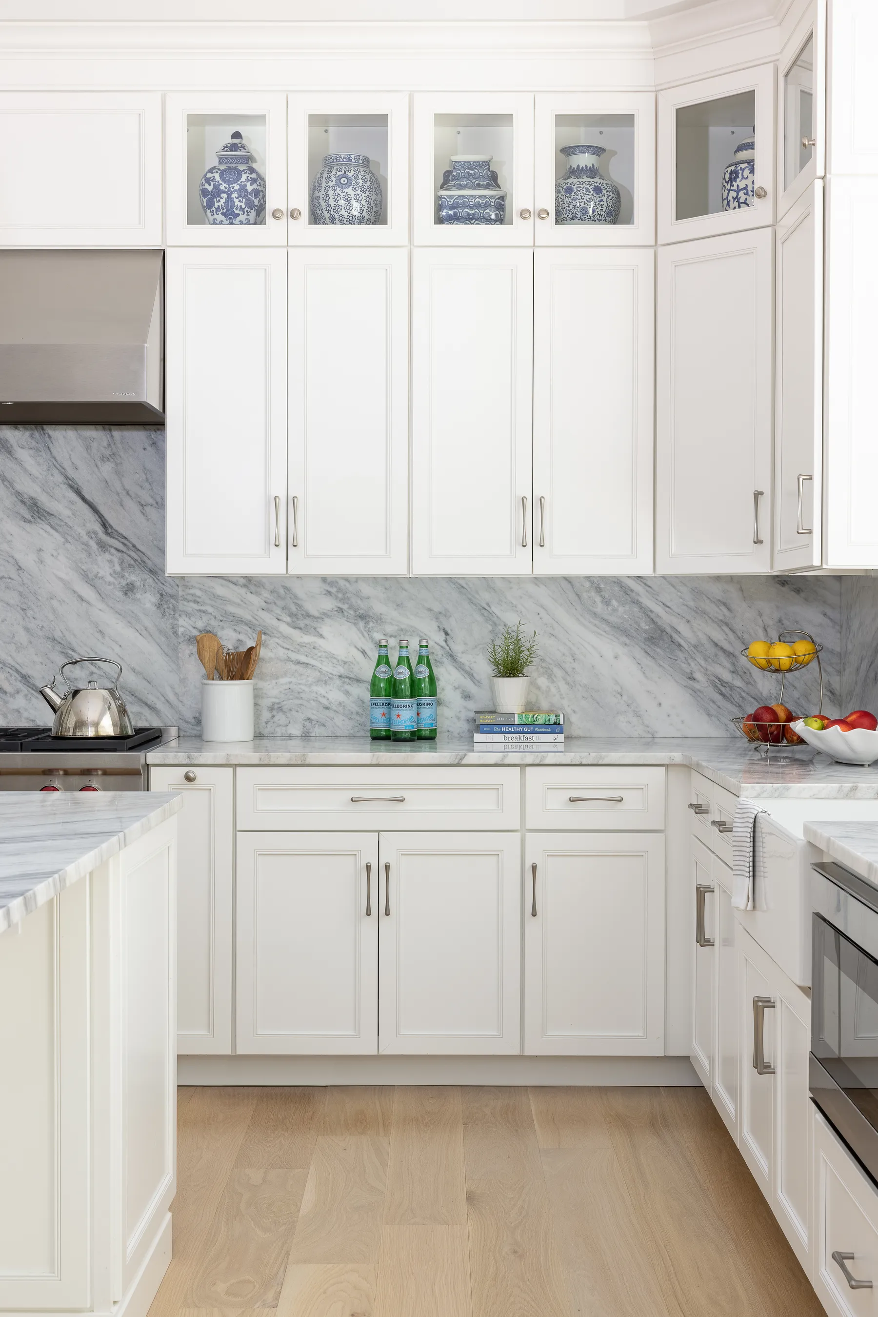 Glass-front uppers display the clients' blue and white porcelain.