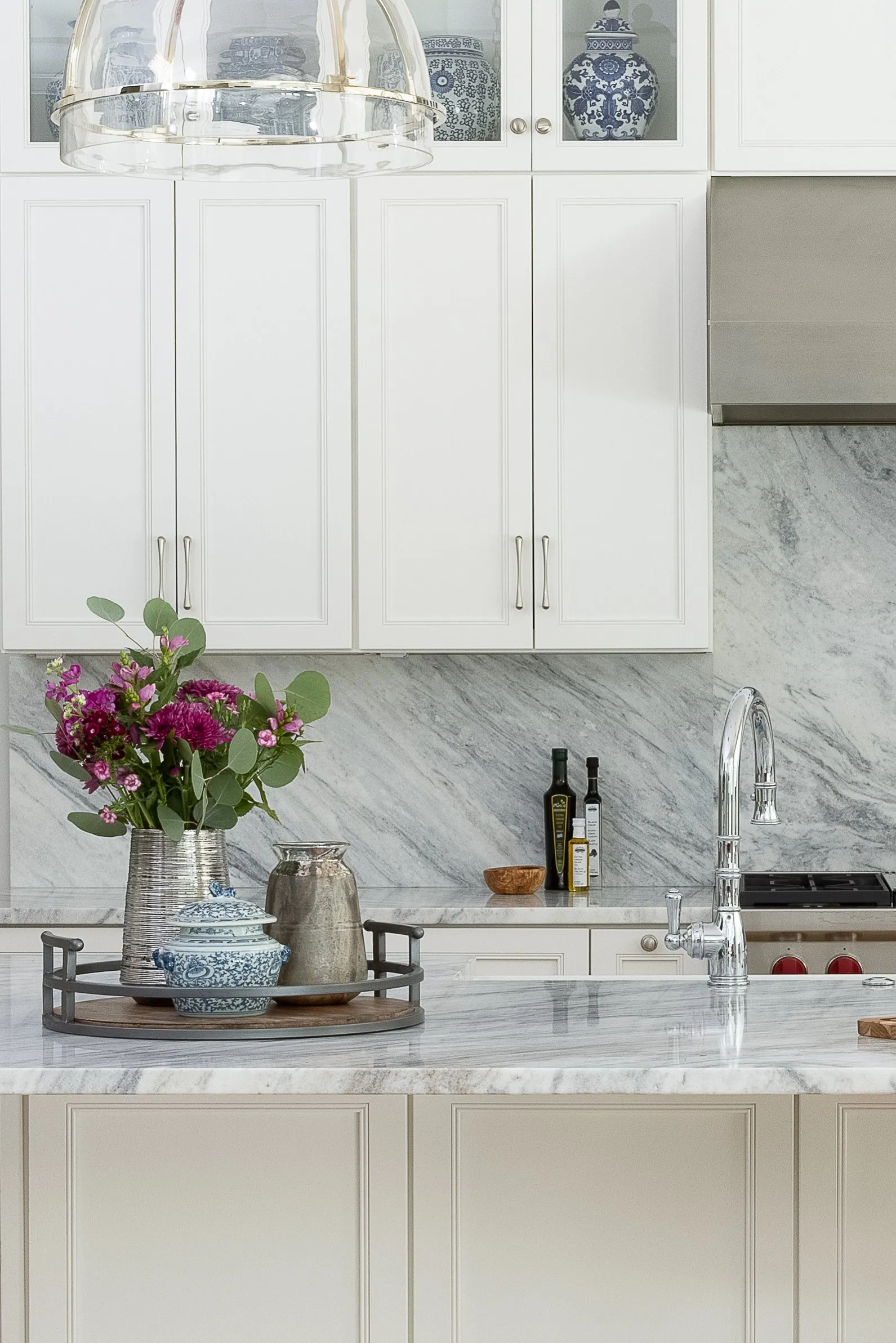 Marble with soft, wave-like veining on the backsplash and counters.