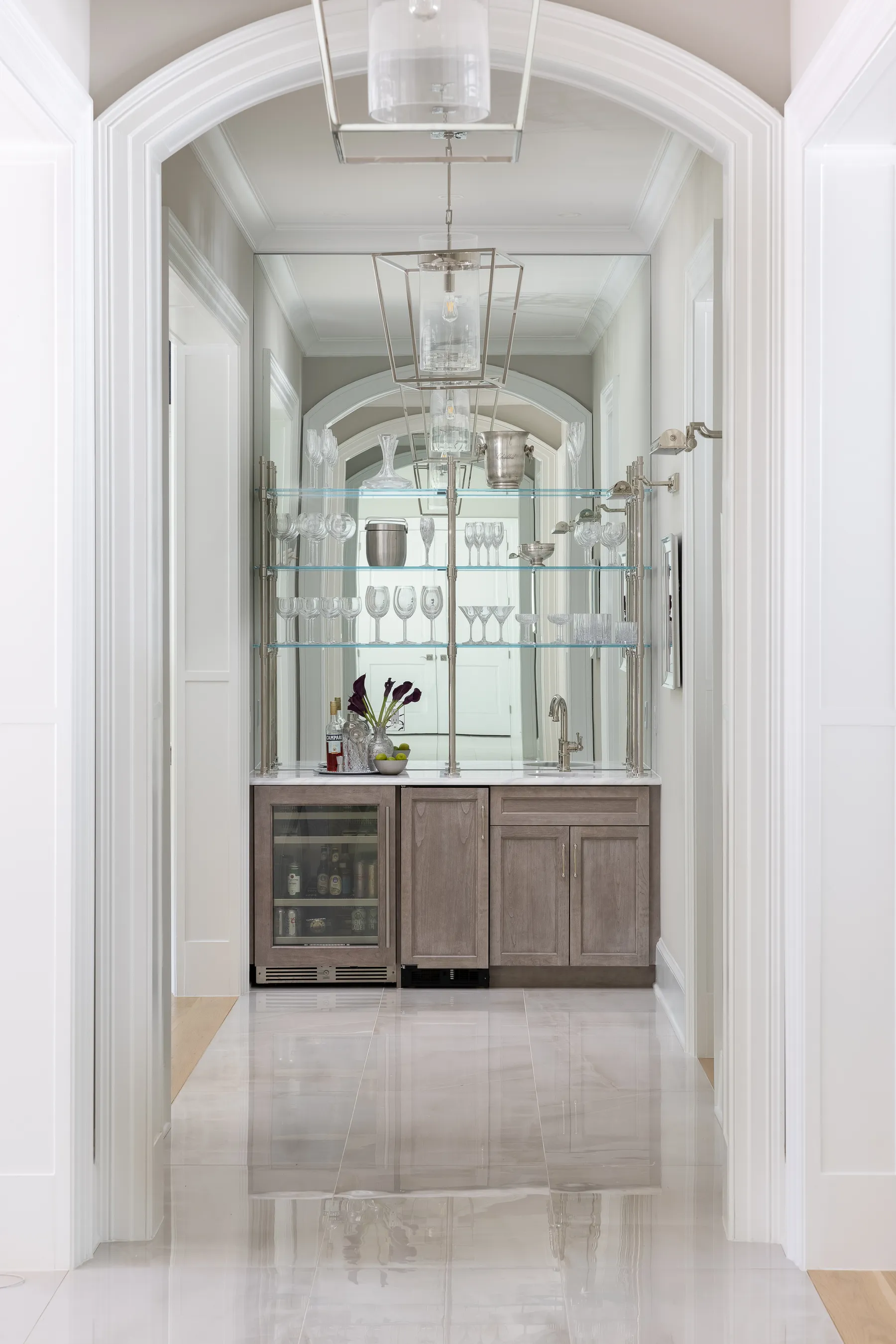 The arched butler's pantry between the kitchen and dining room.