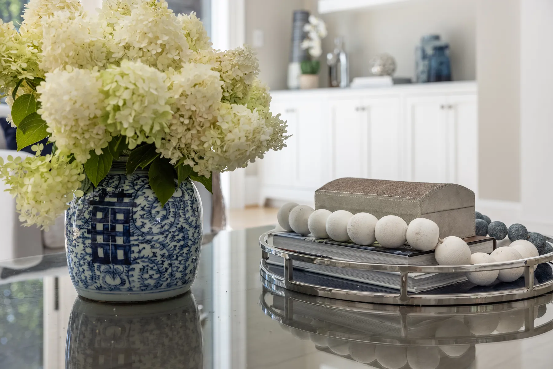 Hydrangeas in a ginger jar on the coffee table.